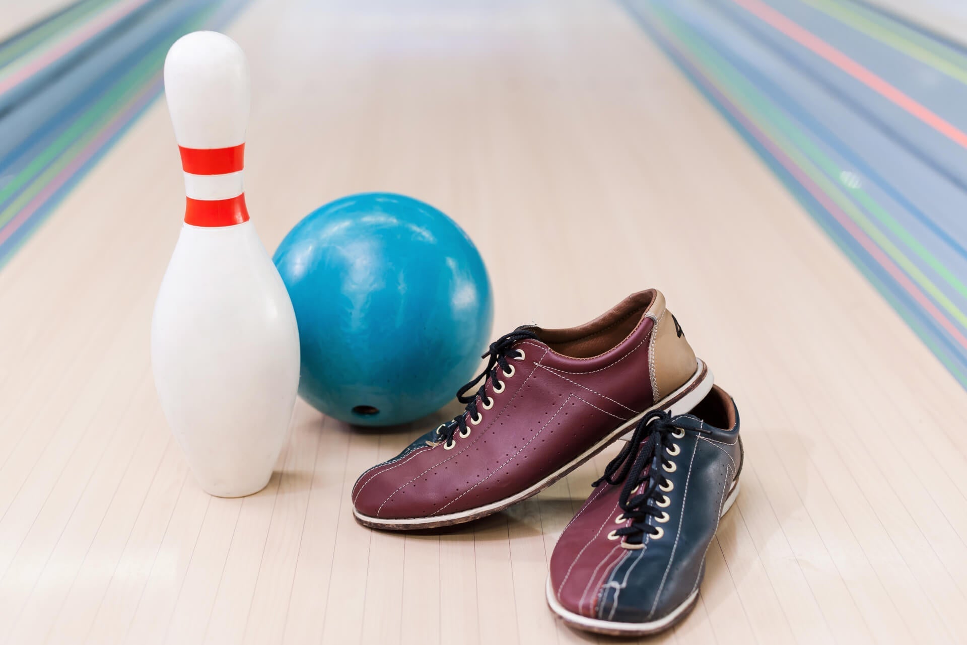 bowling shoes, a ball, and a pin